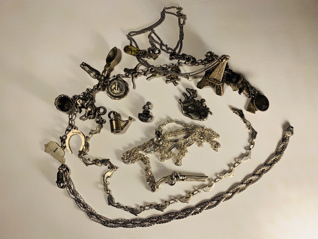 Western Theme Charm Bracelet and other sterling Jewelry: western theme bracelet, dolphin bracelet, flintlock pistol charm necklace total weight 64g