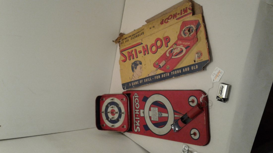 Ski-Hoop by Automatic Toy Co.: Ski-Hoop by Automatic Toy Co. Ski Hoop tin game is in working condition with original box(poor condition). This vintage game also comes with a bag of non original washers. See pictures for condition.