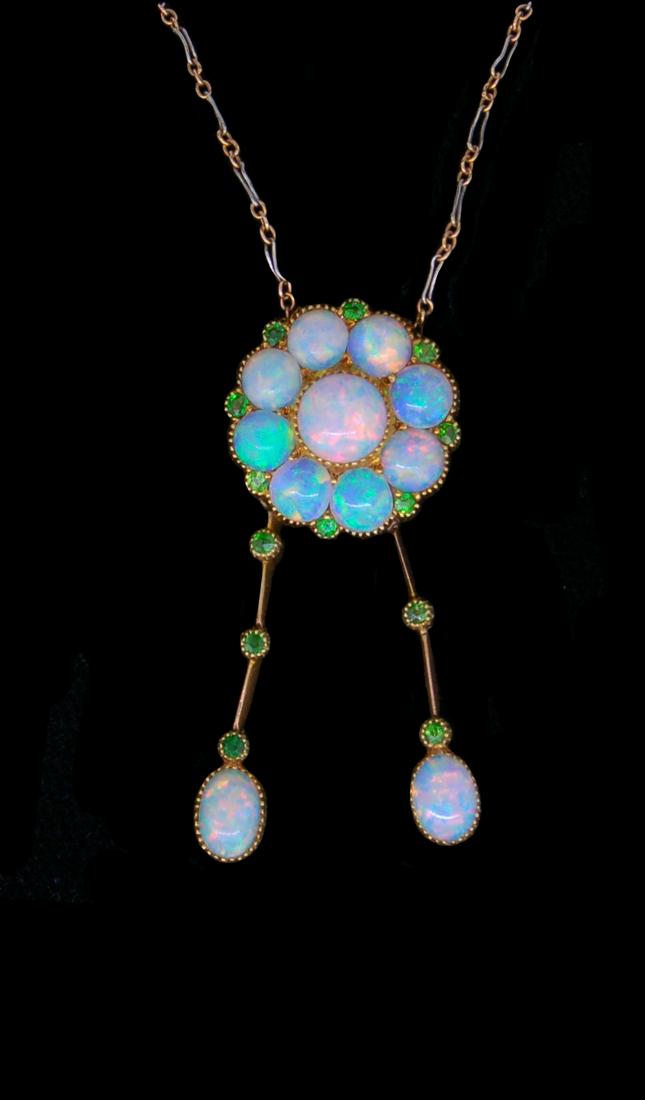 ANTIQUE OPAL DROP PENDANT NECKLACE: ANTIQUE OPAL AND DEMANTOID GARNET DROP PENDANT NECKLACE, set with a cabochon cut opal cluster, accentuated by demantoid garnets. suspending 2 drops set with 2 demantoid garnets, ending with an opal. L