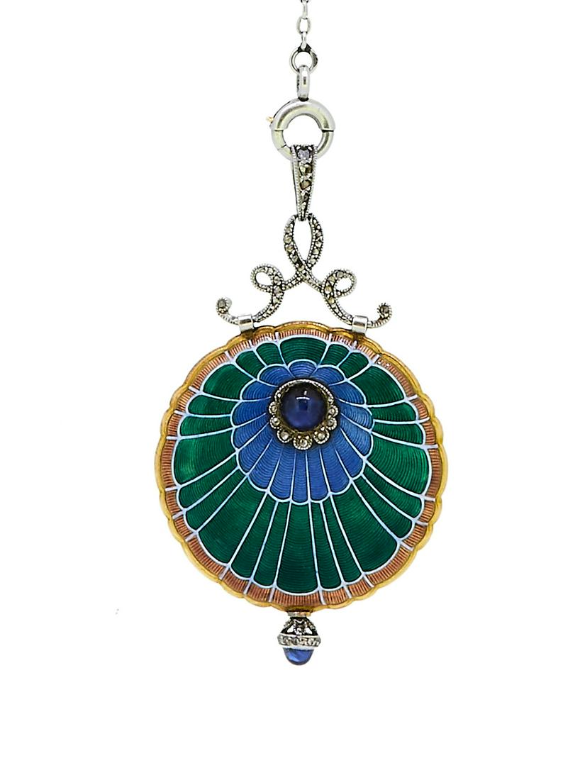 MARCUS & Co, NEW YORK ART-DECO ENAMEL PENDANT WATCH: MARCUS & Co, NEW YORK ART-DECO ENAMEL PENDANT WATCH WITH CHAIN, case back with enamel as peacocks feather a around blue sapphire-cabochon. Silver dial with Arabic numerals, Manual winding, with windin