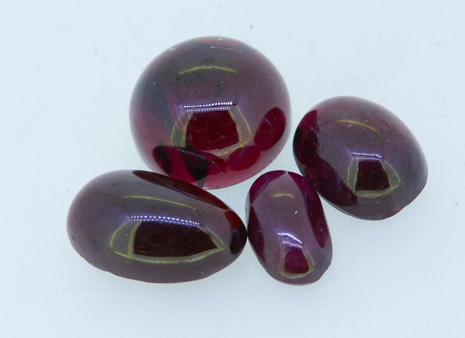 LOT OF MIXED CUT LOOSE GARNETS (1 of 1)
