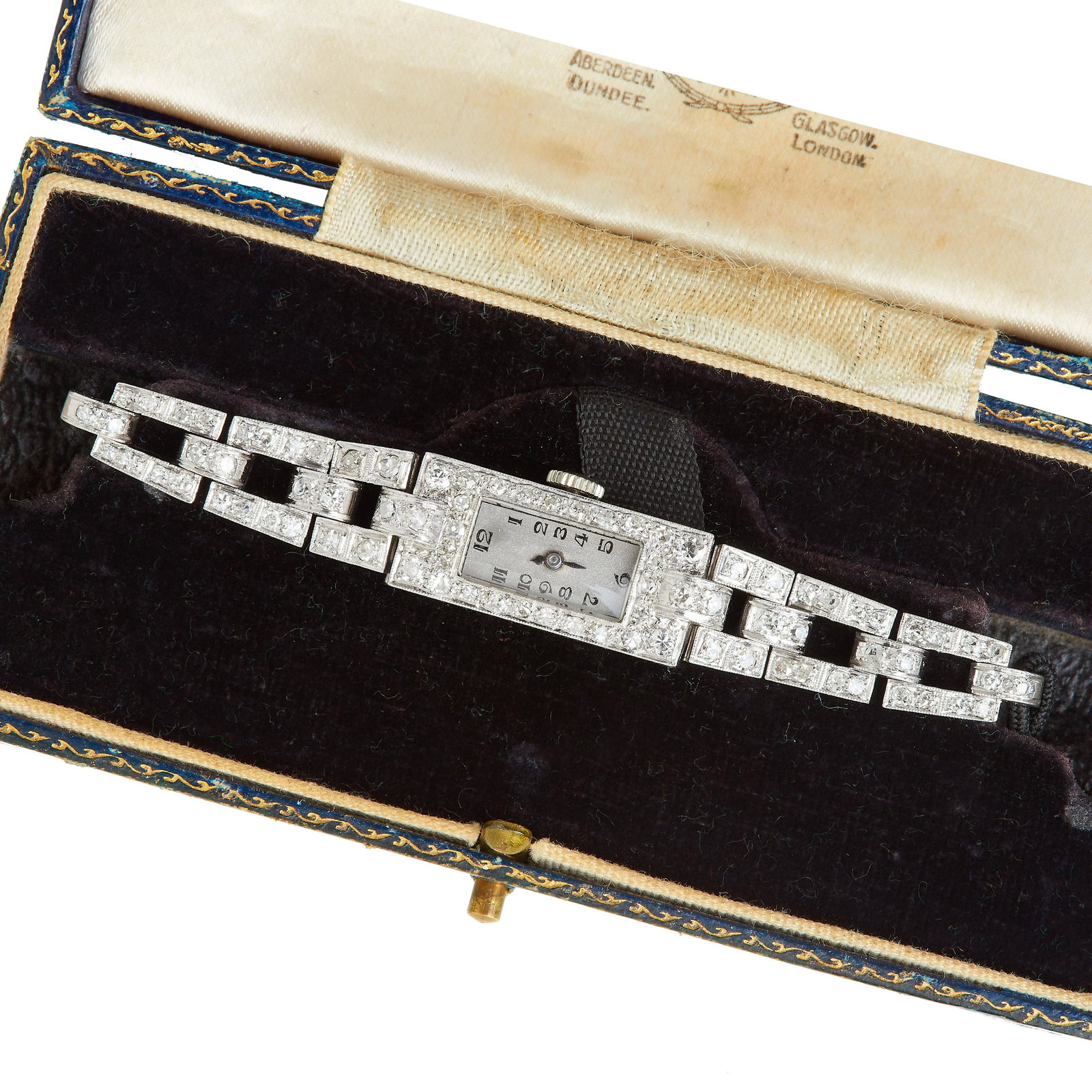 DIAMOND DRESS WATCH: DIAMOND DRESS WATCH, The rectuangular shaped case and 3 additional openwork shoulder links all set with diamonds. The silver coloured dial with Arabic numerals, Manual winding. L. 17 cm. 16.7 grams. W