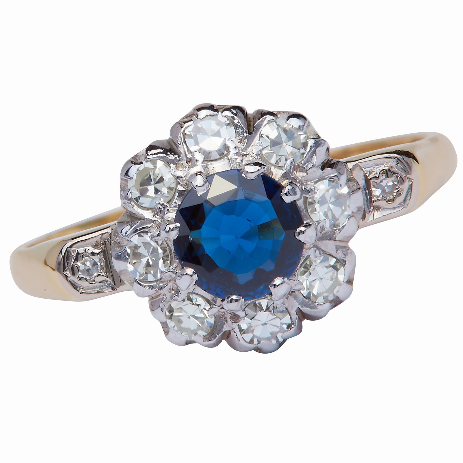 SAPPHIRE AND DIAMOND CLUSTER RING: SAPPHIRE AND DIAMOND CLUSTER RING, in 18 ct. gold. Set with a central blue sapphire of approx. 0.61 ct. Flanked with diamonds and a diamond on each shoulder totalling approx. 0.27 ct. Size M 1/2. 3 gr