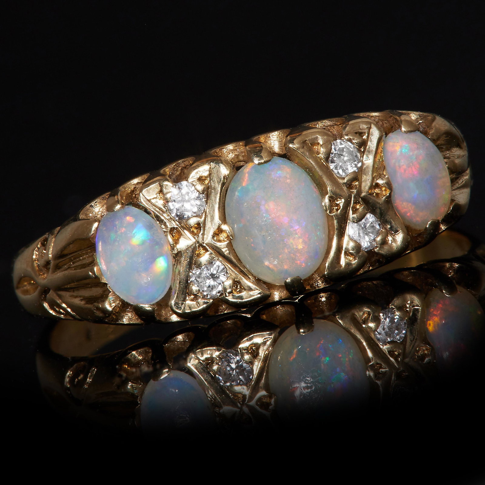 NO RESERVE, THREE STONE OPAL AND DIAMOND RING: NO RESERVE, THREE STONE OPAL AND DIAMOND RING. Set with 3 oval cabochon cut opals. flanked with diamonds. size M. 1.8 grams.