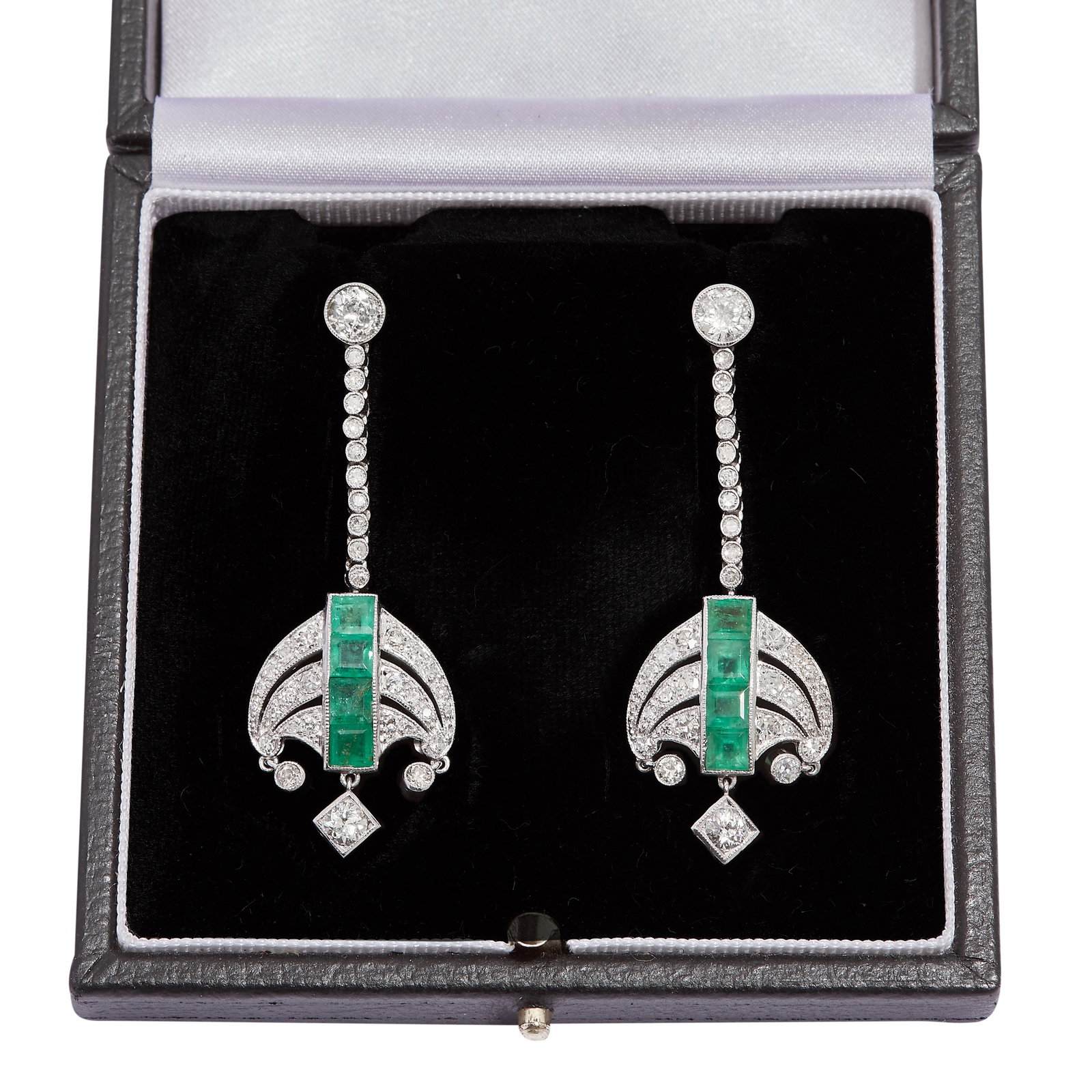 PAIR OF EMERALD AND DIAMOND DROP EARRINGS: PAIR OF EMERALD AND DIAMOND DROP EARRINGS, set with a larger diamond top, suspending a 10 diamond drop which further holds the scrolling chandelier drop. The drop set with 4 square cut emeralds to the