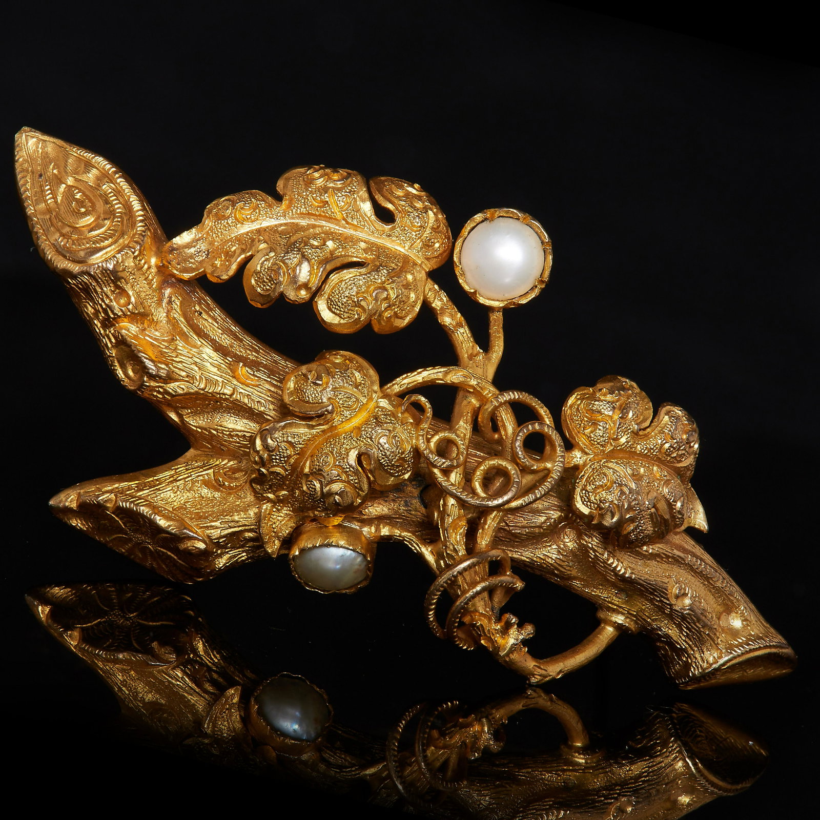 VICTORIAN PEARL BRANCH BROOCH: VICTORIAN PEARL BRANCH BROOCH, designed in 3-D as a branch with leaves, accentuated with 2 pearls. W. 5.4 cm. 7.7 grams.