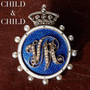CHILD AND CHILD, ENAMEL AND PEARL QUEEN VICTORIA INITIAL BROOCH: CHILD AND CHILD, ENAMEL AND PEARL QUEEN VICTORIA INITIAL BROOCH, The brooch of round design, with the initials V R for Queen Victoria, on a blue enamel background with pearls to the surmount. Topped w