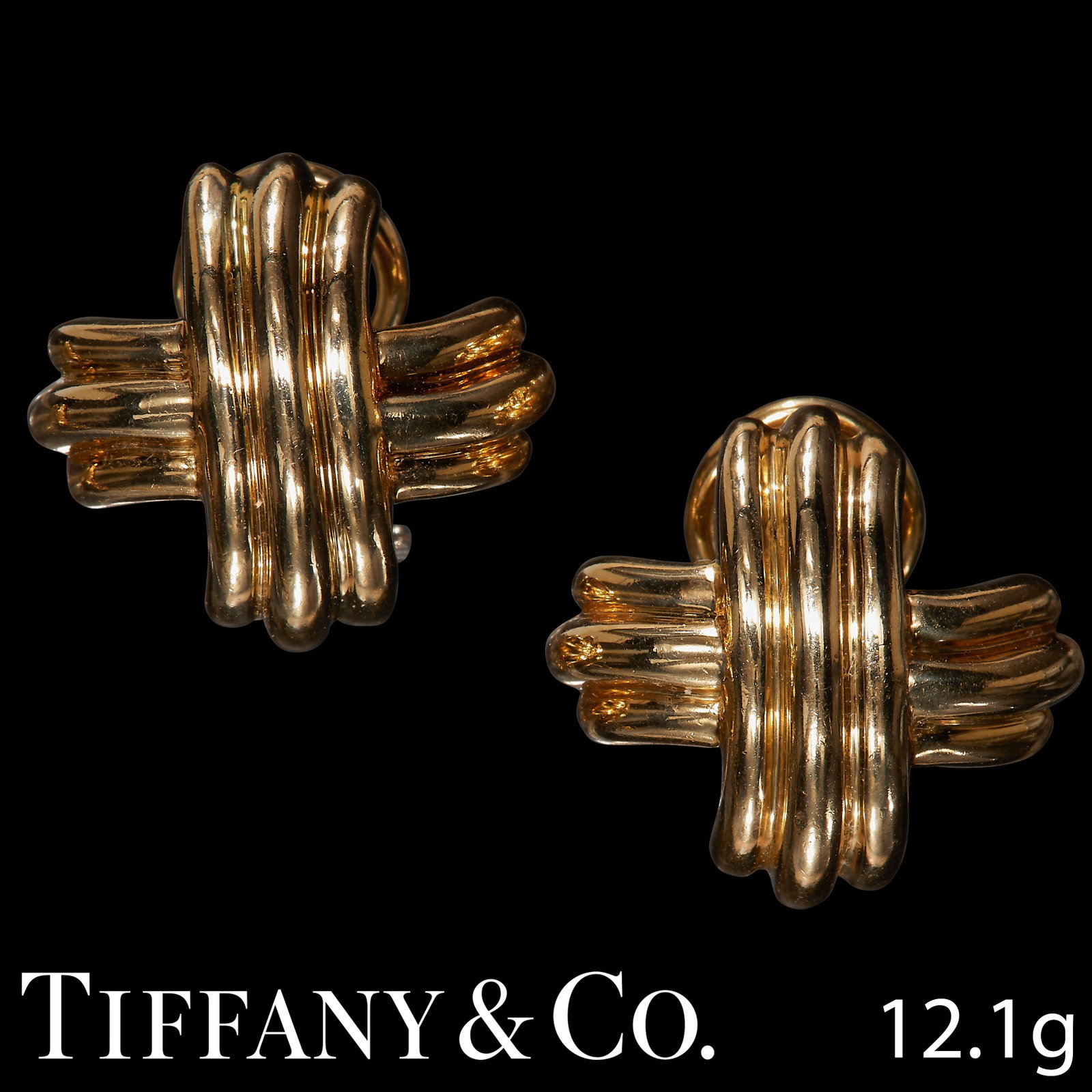 TIFFANY & CO, PAIR OF SIGNATURE X EARRINGS: TIFFANY & CO, PAIR OF SIGNATURE X EARRINGSin 18 ct. gold.Each of 3-band design.Signed T&Co.W. 1.8 cm. 12.1 grams.Lovely condition.