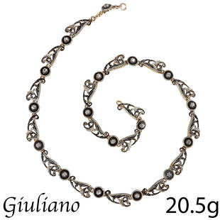 CARLO GIULIANO, STUNNING ENAMEL AND DIAMOND NECKLACE: CARLO GIULIANO, STUNNING ENAMEL AND DIAMOND NECKLACE,High carat gold.The links of scrolling wing design, decorated with black and white ename.each link alternated with a round enameled and diamond set