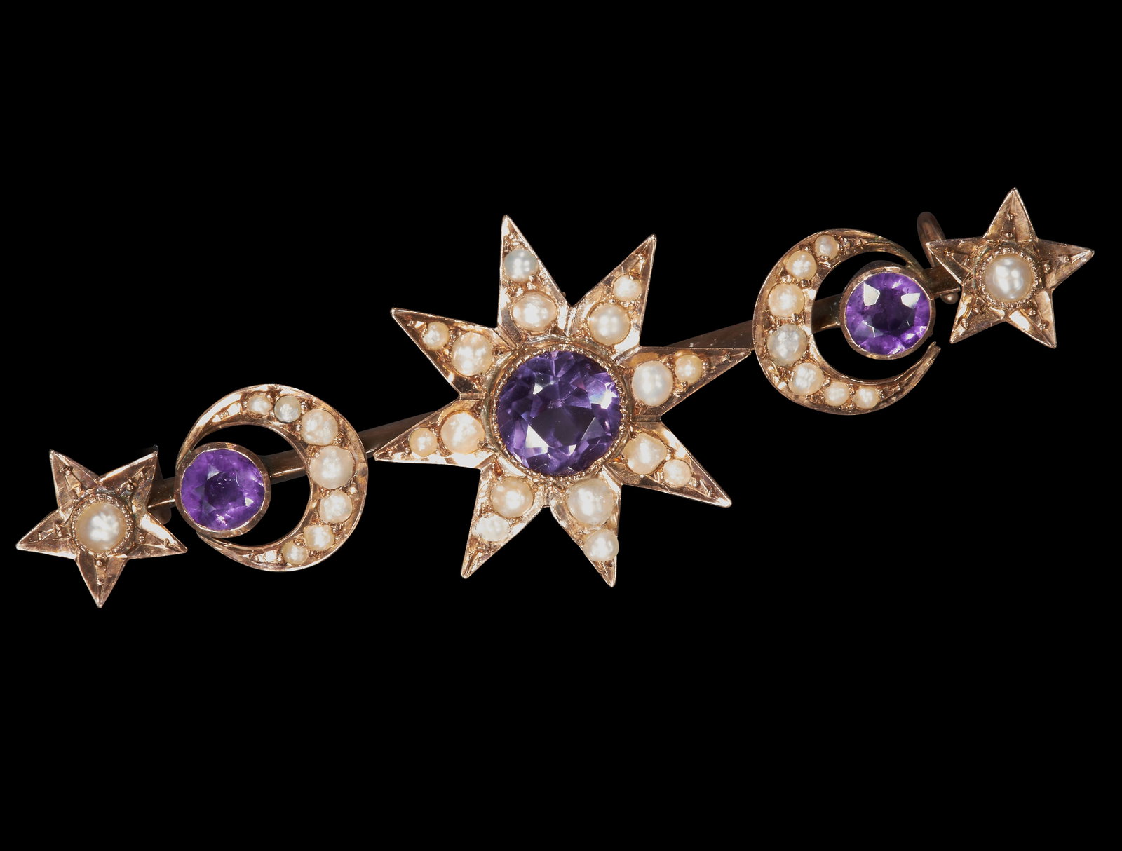 AMETHYST AND PEARL STAR AND THE MOON GOLD BROOCH: AMETHYST AND PEARL STAR AND THE MOON GOLD BROOCH. Rich and vibrant amethyst.Pearls well matched (untested).W 4.7 cm. 2.3 grams.