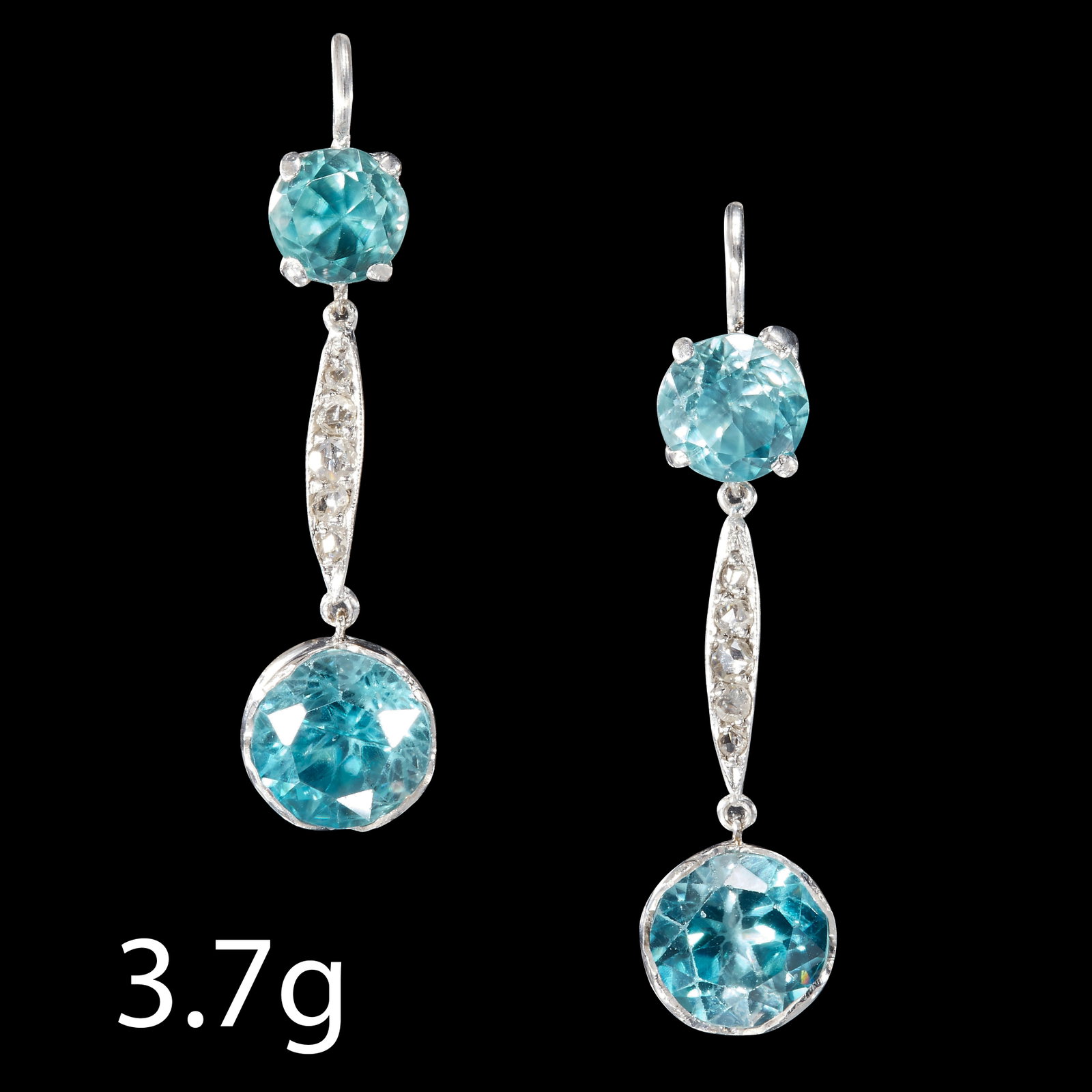 PAIR OF ZIRCON AND DIAMOND EARRINGS: PAIR OF ZIRCON AND DIAMOND EARRINGS.Set with vibrant zircons.L: 32.7 mm.3.7 gram.