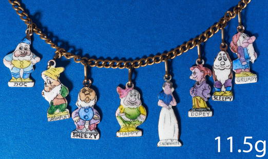 DISNEY, SNOW WHITE AND THE 7 DWARFS ENAMEL CHARM BRACELET: DISNEY, SNOW WHITE AND THE 7 DWARFS ENAMEL CHARM BRACELET, Set with 7 enameled charms depicting Snow white, Bashful, Happy, Grumpy, Dopey, Sleepy, Sneezy and doc.. L 17.5 cm. 11.5 grams.