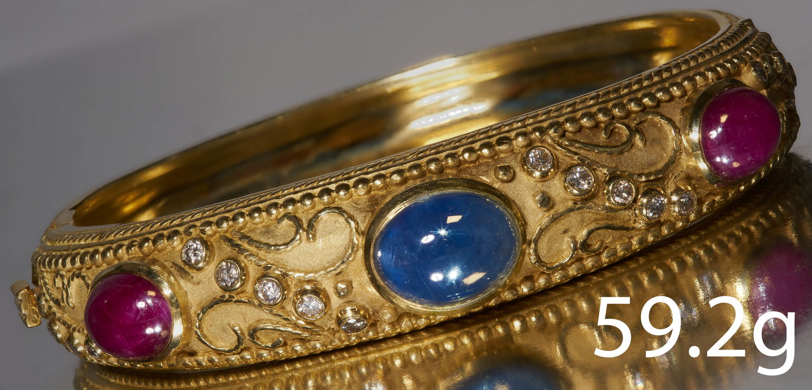 FINE AND UNUSUAL ETRUSCAN REVIVAL SAPPHIRE RUBY AND DIAMOND HINGED BANGLE (1 of 1)