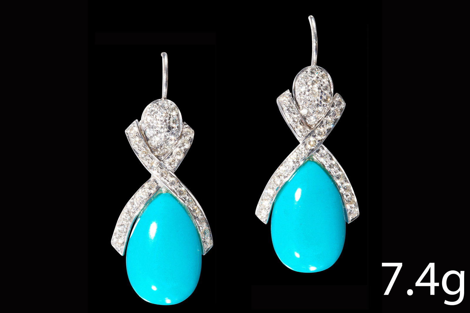 ATTRACTIVE PAIR OF TURQUOISE AND DIAMOND DROP EARRINGS: ATTRACTIVE PAIR OF TURQUOISE AND DIAMOND DROP EARRINGS, High carat gold.The tops set with bright and lively diamonds in stylized X shapeTurquoise vibrant and well matched.L. 2.8 cm.7.4 grams.