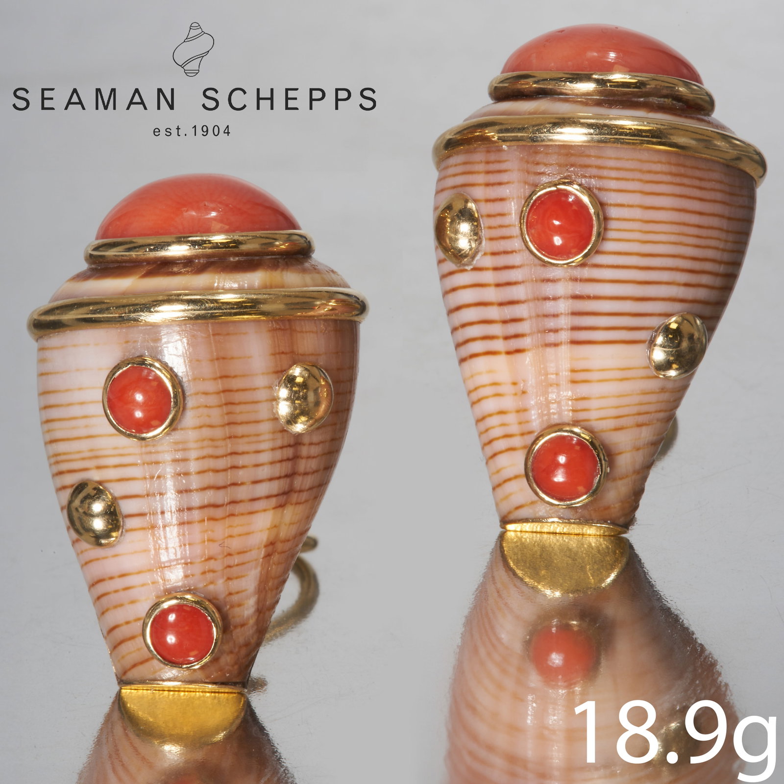 A PAIR OF GOLD SHELL AND CORAL EARRINGS: A PAIR OF GOLD SHELL AND CORAL EARRINGS.High carat gold.Length: 29.37 mm.18.9 gram.in the manner of Seaman Schepps