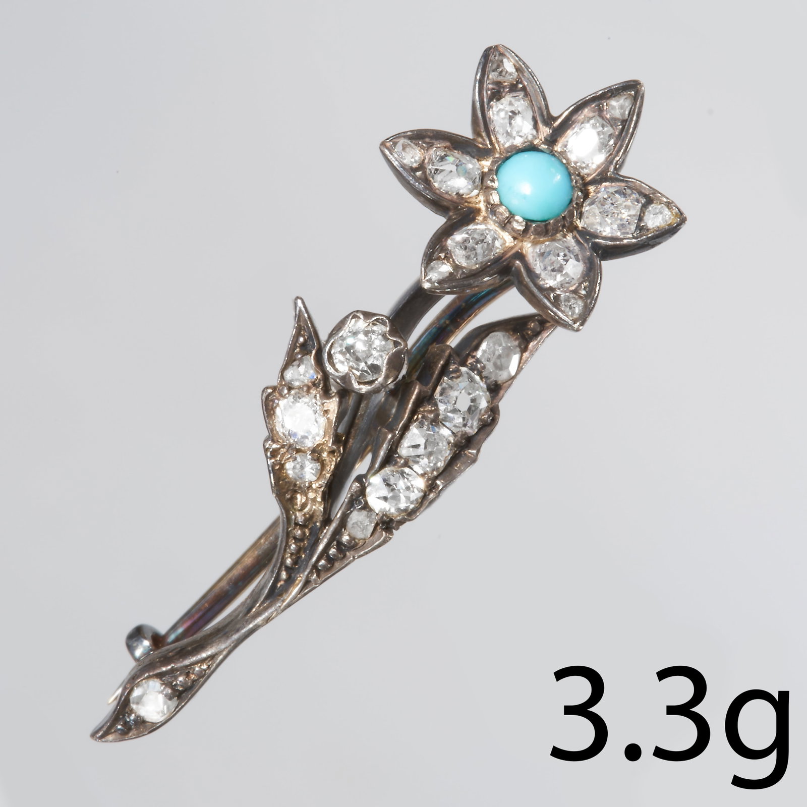 VICTORIAN DIAMOND AND TURQUOISE FLOWER BROOCH: VICTORIAN DIAMOND AND TURQUOISE FLOWER BROOCH.Set with bright and lively diamonds.Length: 34.73 mm3.3 gram.