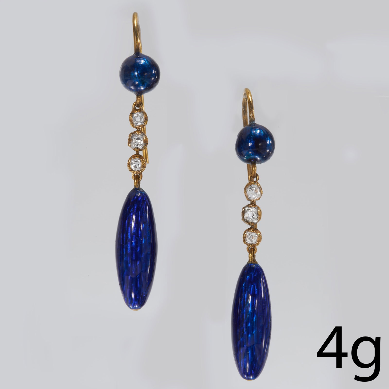 PAIR OF ENAMEL AND DIAMOND DROP EARRINGS: PAIR OF ENAMEL AND DIAMOND DROP EARRINGS,High carat gold.Diamonds bright and lively.Rich and vibrant blue enamel, in good condition.L. 4.1 cm.4 grams.