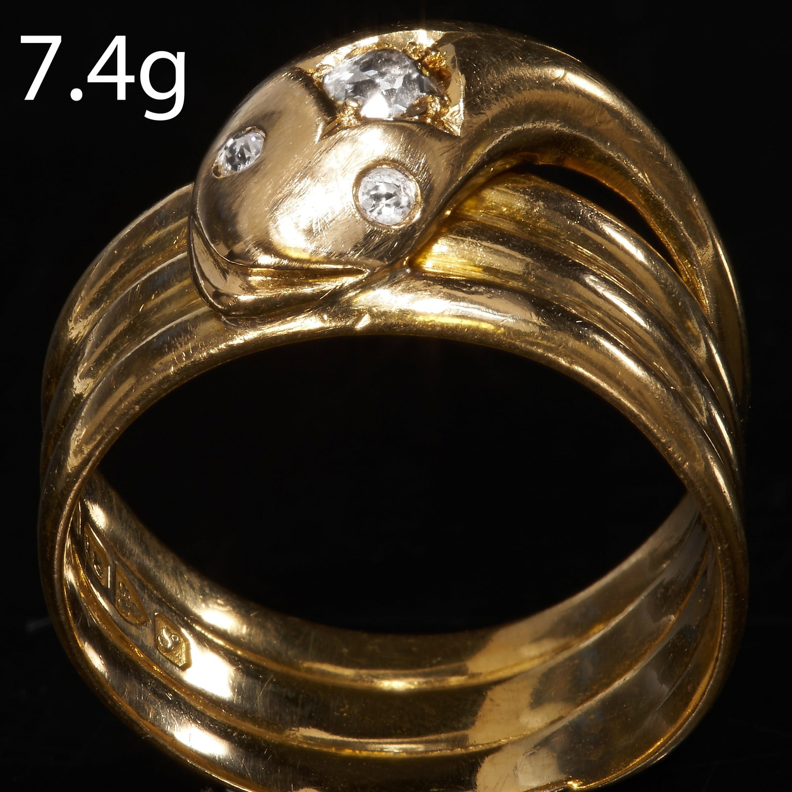 DIAMOND SNAKE RING: DIAMOND SNAKE RING,18 ct. gold.coiled design.Diamonds bright and lively.Size N.7.4 grams.