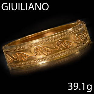 CARLO GIULIANO, ETRUSCA REVIVAL BANGLE: CARLO GIULIANO, ETRUSCA REVIVAL BANGLE,High carat gold.The top of the bangle with fine wirework design.Makers mark C.G. and retailers marks.Early Giuliano example.Inner diam: 5.6 cm.39.1 gram.Bangle i