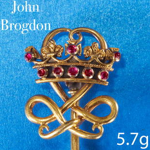 JOHN BROGDEN, FINE ANTIQUE RUBY CROWN STICK PIN: JOHN BROGDEN, FINE ANTIQUE RUBY CROWN STICK PIN,High carat goldThe crown set with rubies.Signed Brogden.L. head 2 cm.5.7 grams.