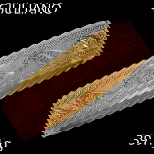 CARLO GIULIANO, ETRUSCA REVIVAL BANGLE: CARLO GIULIANO, ETRUSCA REVIVAL BANGLE,39.1 grams, testing 18 ct. gold.The top of the bangle with fine wirework design.Makers mark C.G. and retailers marks.Early Giuliano example.Inner diam: 5.6 cm.Ba