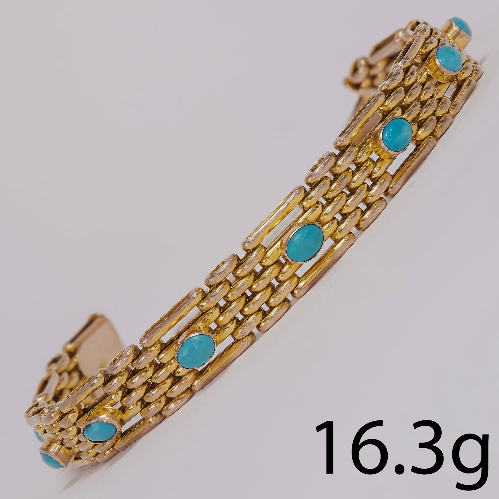 ANTIQUE TURQUOISE GOLD GATE BRACELET: ANTIQUE TURQUOISE GOLD GATE BRACELET,16.3 grams.10 cabochon cut turquoise.L. 18.5 cm.