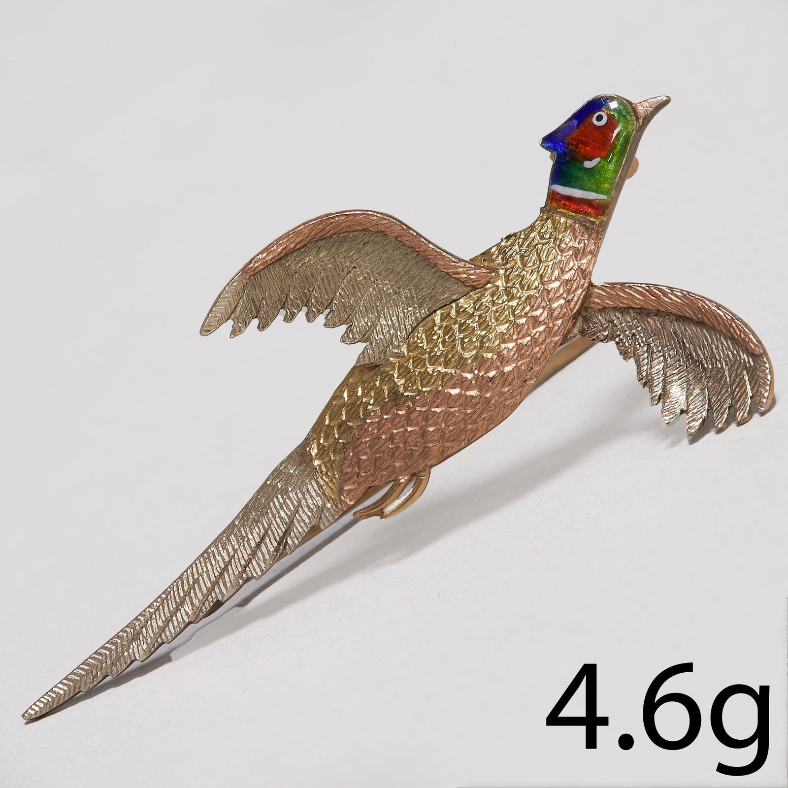 ANTIQUE ENAMEL, 3 COLOUR GOLD PHEASANT BROOCH: ANTIQUE ENAMEL, 3 COLOUR GOLD PHEASANT BROOCH,4.6 grams.L. 5.1 cm.