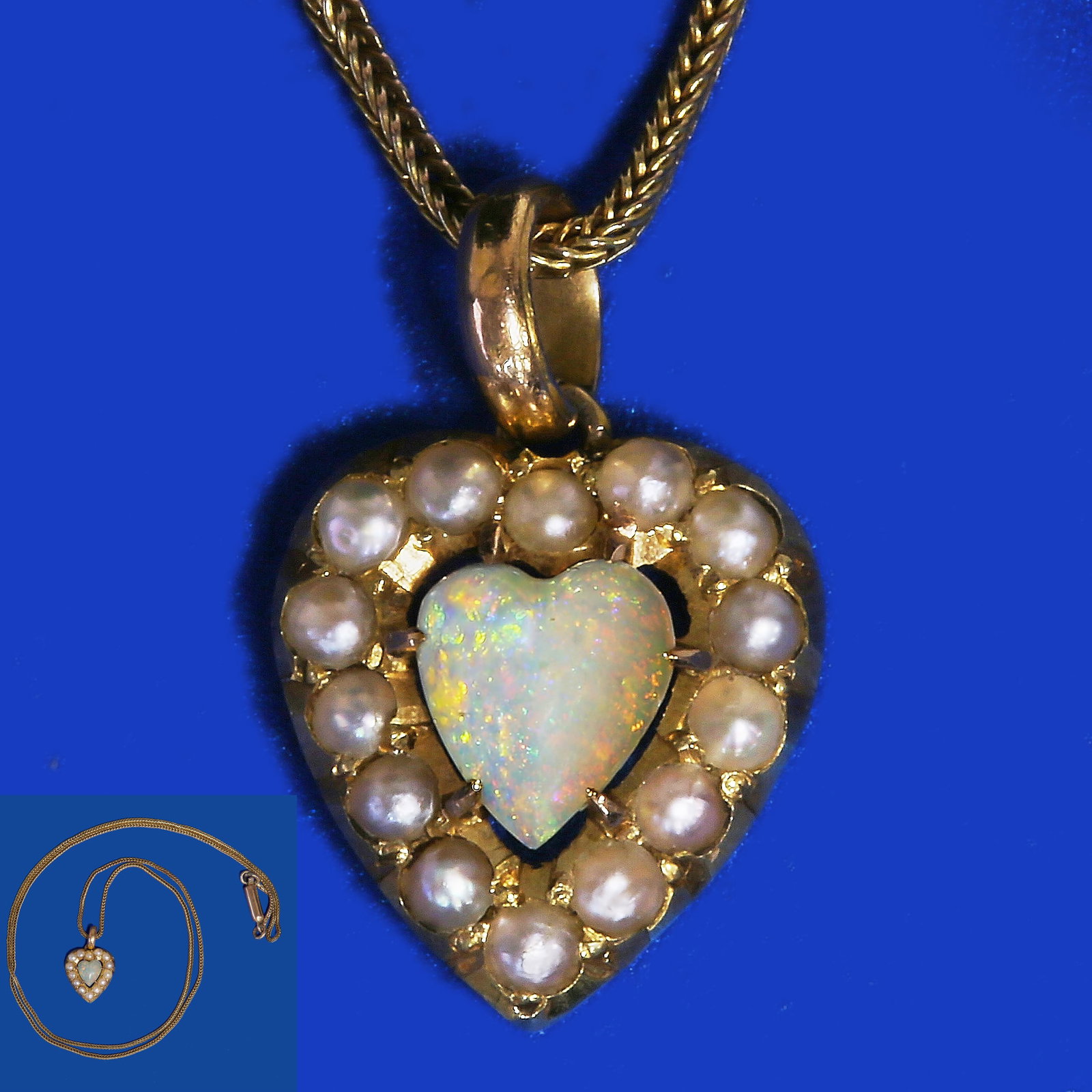 SWEET OPAL AND PEARL HEART PENDANT WITH GOLD CHAIN: SWEET OPAL AND PEARL HEART PENDANT WITH GOLD CHAIN, Vibrant opal with good play of colour. Pearls generally well matched. L. necklace 40 cm.