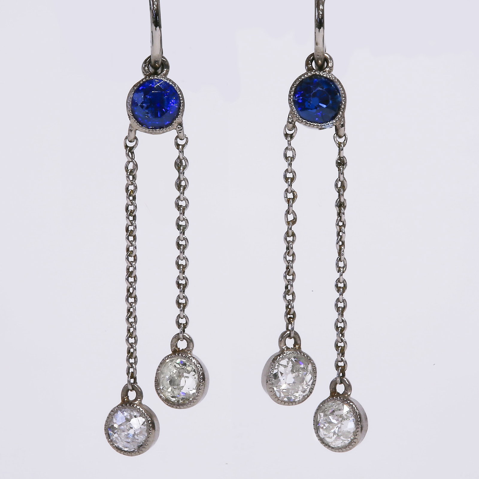 PAIR OF SAPPHIRE AND DIAMOND EARRINGS: PAIR OF SAPPHIRE AND DIAMOND EARRINGS High carat gold.rich vibrant sapphires with bright lively diamonds L 3.5 cm.