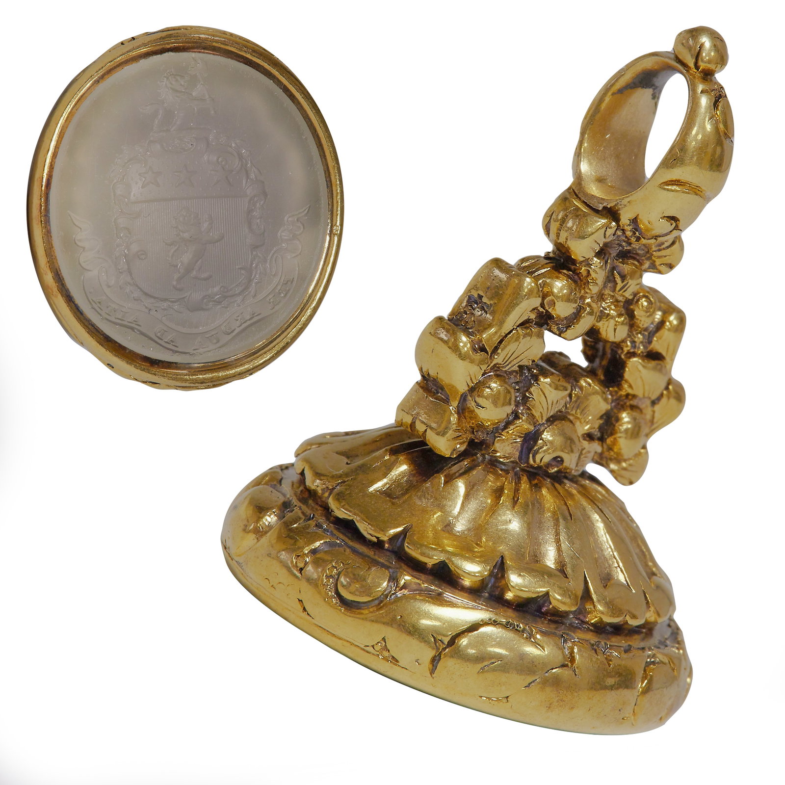 ANTIQUE GOLD FOB SEA: ANTIQUE GOLD FOB SEAL,19.4 grams. testing high carat gold.Fine relief detailed decoration.Detailed carved intaglio with family crest and text.3.3 cm.