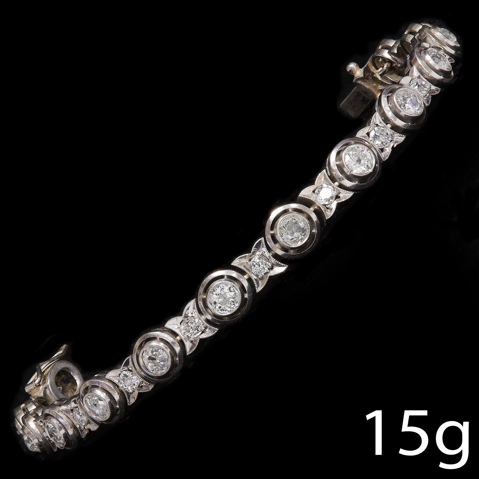 DIAMOND BRACELET: DIAMOND BRACELET15 grams, testing platinum.Old cut diamonds bright and lively, totalling approx. 4.70 ct.L. 16.5 cm.