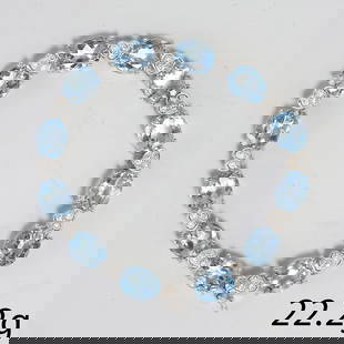 BLUE TOPAZ AND DIAMOND BRACELET,: BLUE TOPAZ AND DIAMOND BRACELET,23.1 grams, 18 ct. gold.Vibrant blue topaz.Diamonds bright and lively.L. 18 cm.