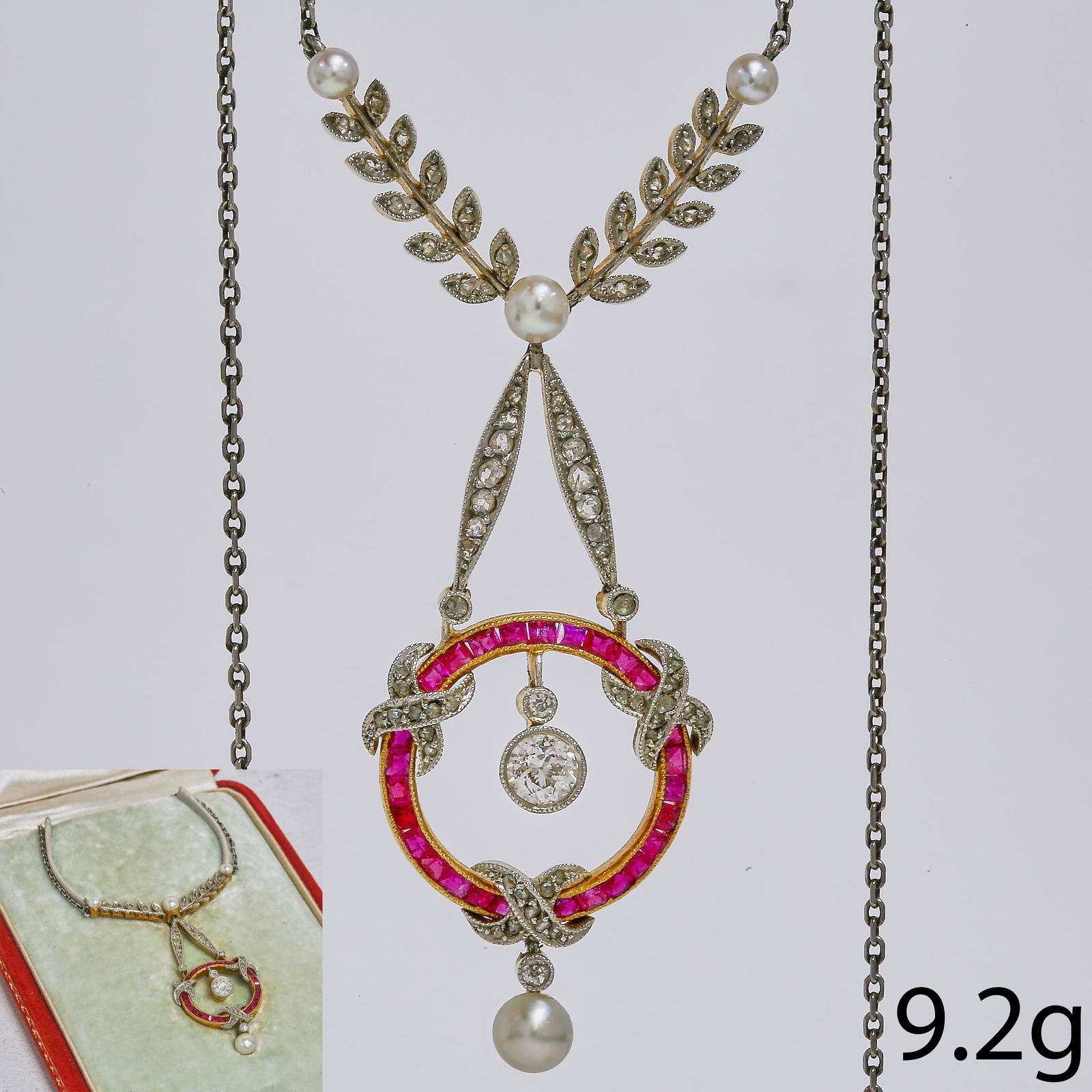 FINE BELLE EPOQUE RUBY DIAMOND AND PEARL PENDANT NECKLACE,: FINE BELLE EPOQUE RUBY DIAMOND AND PEARL PENDANT NECKLACE,9.2 grams, testing platinum and high carat gold.Fine rubies.Diamonds bright and lively.L. pendant 5.4 cm.L. total necklace 38 cm.Antique fitte