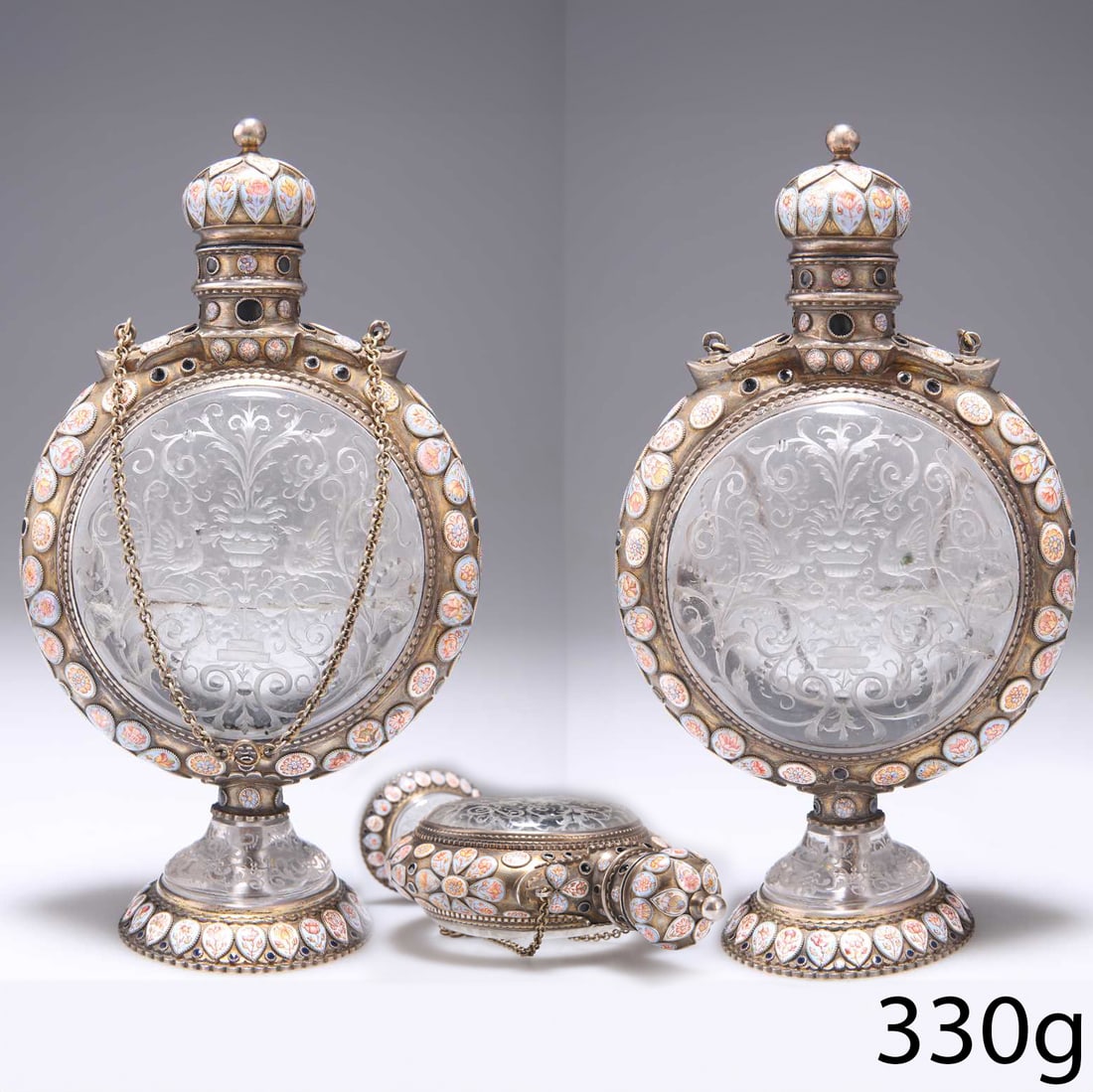HERMANN RATZERSDORFER, VIENNA, FINE SILVER, ENAMEL AND ROCK CRYSTAL FLASK: HERMANN RATZERSDORFER, VIENNA, FINE SILVER, ENAMEL AND ROCK CRYSTAL FLASK,330 grams The 2 rock crystal sections depicting etched floral design and birds.The foot, surmount and lid with fine multi-colo