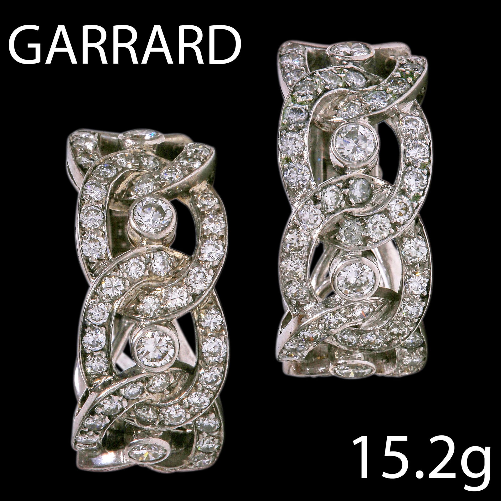 GARRARD, PAIR OF DIAMOND HOOP EARRINGS: GARRARD, PAIR OF DIAMOND HOOP EARRINGS,15.2 grams, 18 ct. gold.Diamonds bright and lively, totalling approx. 2.25 ct.L. 2.3 cm.