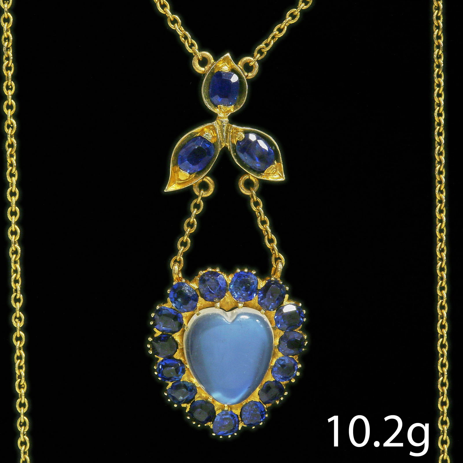 ELEGANT ART NOUVEAU HEART SHAPED SAPPHIRE AND MOONSTONE NECKLACE: ELEGANT ART NOUVEAU HEART SHAPED SAPPHIRE AND MOONSTONE NECKLACE 10.2 grams high carat gold Rich vibrant matching sapphiresapprox. 2.80 ct. vibrant moonstone in great condition pendant L 4.5 cm chain