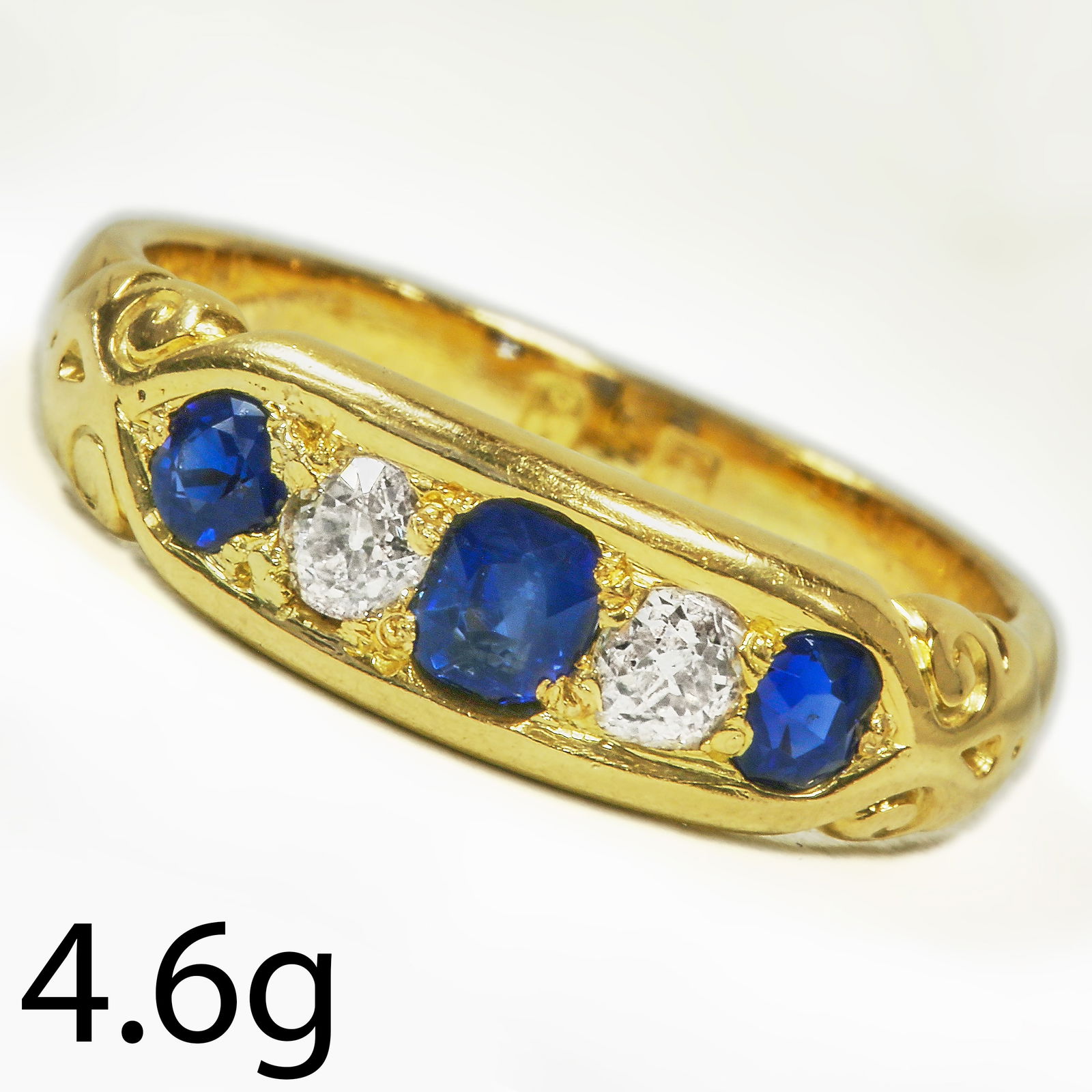 SAPPHIRE AND DIAMOND 5-STONE RING: SAPPHIRE AND DIAMOND 5-STONE RING,4,6 grams, testing high carat gold.Rich and vibrant sapphires.Diamonds bright and lively.Size Q.