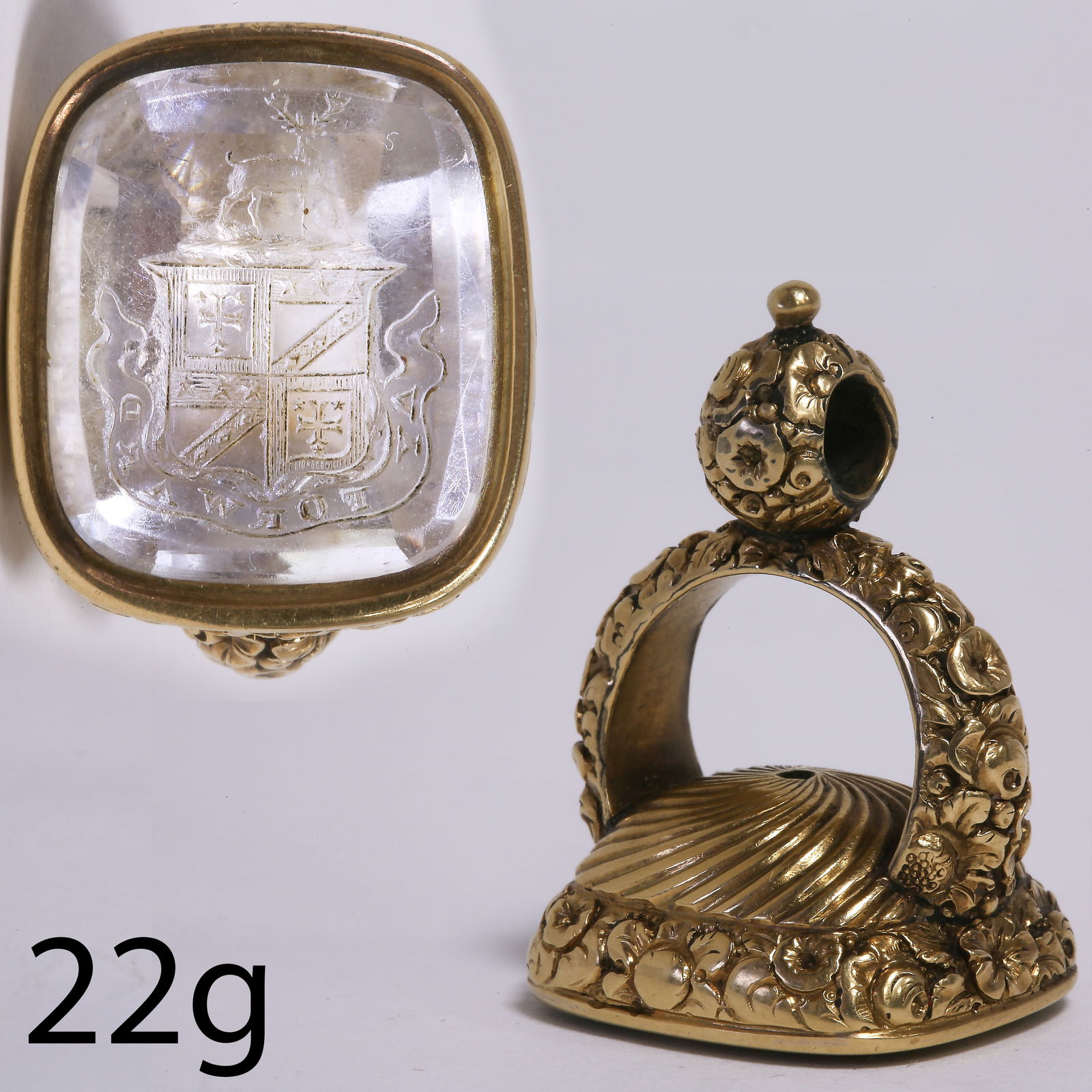 ANTIQUE FOB SEAL WITH HARDSTONE INTAGLIO: ANTIQUE FOB SEAL WITH HARDSTONE INTAGLIO,22 grams, testing high carat gold.The carved hardstone depicting a heraldic family crest topped with a stag.L. 3.5 cm.