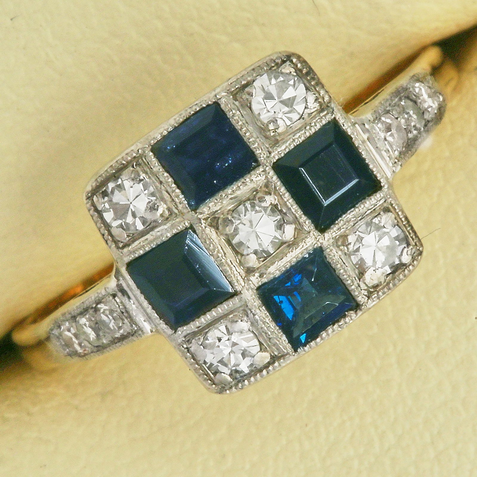 SAPPHIRE AND DIAMOND CLUSTER RING: SAPPHIRE AND DIAMOND CLUSTER RING,testing high carat gold and platinum.vibrant sapphires.diamonds bright and lively.Checkerboard design.Size O.