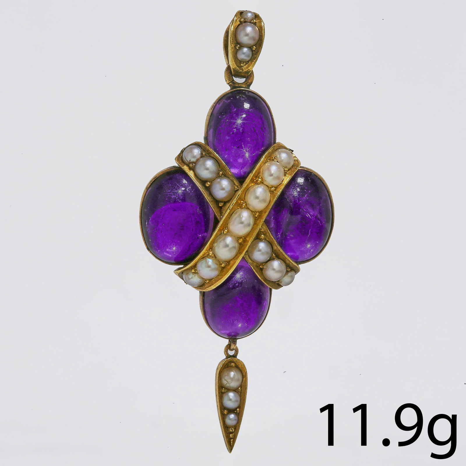 VICTORIAN AMETHYST AND PEARL PENDANT: VICTORIAN AMETHYST AND PEARL PENDANT,11.9 grams, testing high carat gold.Amethyst rich in colour, cabochon cut.Pearls well matched (untested, assumed to be natural).Locket back.L. 5,6 cm.