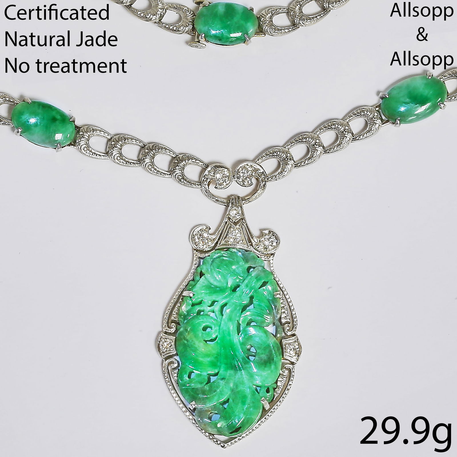 ALLSOPP AND ALLSOPP CERTIFICATED NATURAL JADE AND DIAMOND NECKLACE: ALLSOPP AND ALLSOPP CERTIFICATED NATURAL JADE AND DIAMOND NECKLACE,29.9 grams. High carat gold and platinum.Fine carved jade plaque.Diamonds bright and lively.Makers mark A&A.39 cm.See certificate.