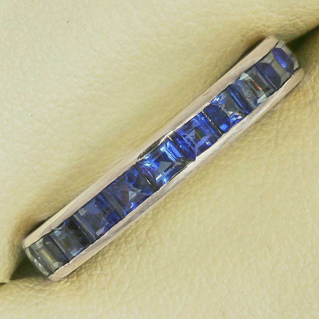SAPPHIRE FULL ETERNITY RING: SAPPHIRE FULL ETERNITY RING,3 grams, testing platinum.Vibrant sapphires, totalling approx. 1.80 ct.Size K.