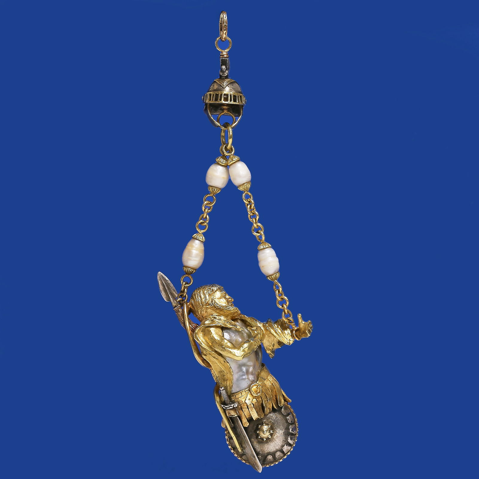 RARE ANTIQUE PEARL WARRIOR PENDANT: RARE ANTIQUE PEARL WARRIORPENDANT49.8 grams, 18 ct. gold and silver.The body set with a large pearl (assumedto be natural).Intricate designed as a roman warrior.Suspending from a pearl set