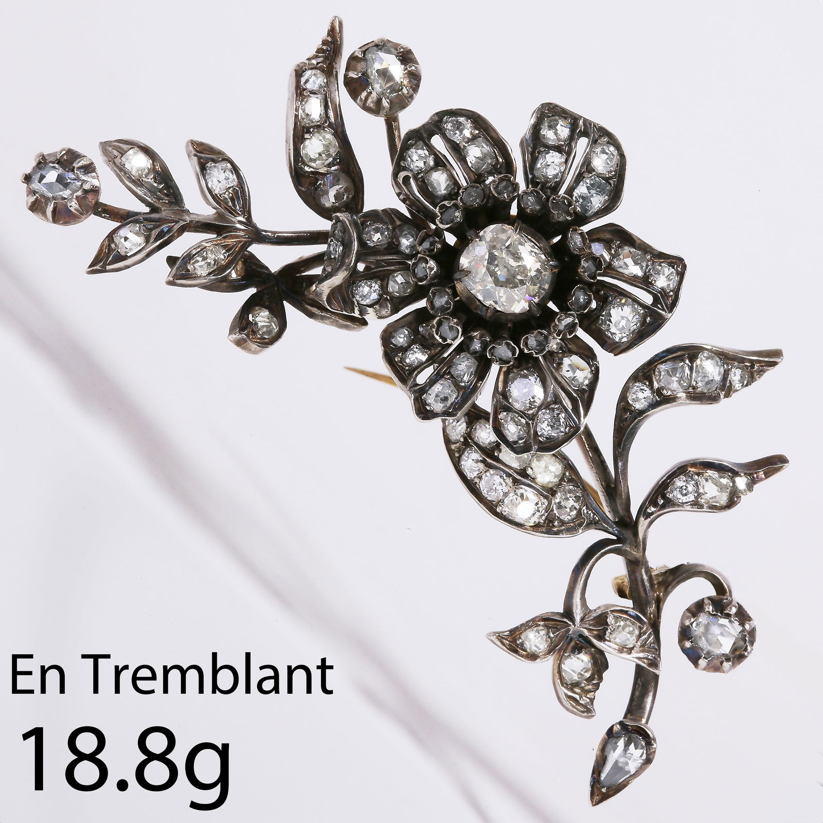 FINE ANTIQUE VICTORIAN 'EN TREMBLANT' DIAMOND FLORAL BROOCH: FINE ANTIQUE VICTORIAN 'ENTREMBLANT' DIAMOND FLORAL BROOCH18.8 gramscentral diamond approx. 1.17 ctdiamonds totalling approx. 4.25 ctL 6.9 cm