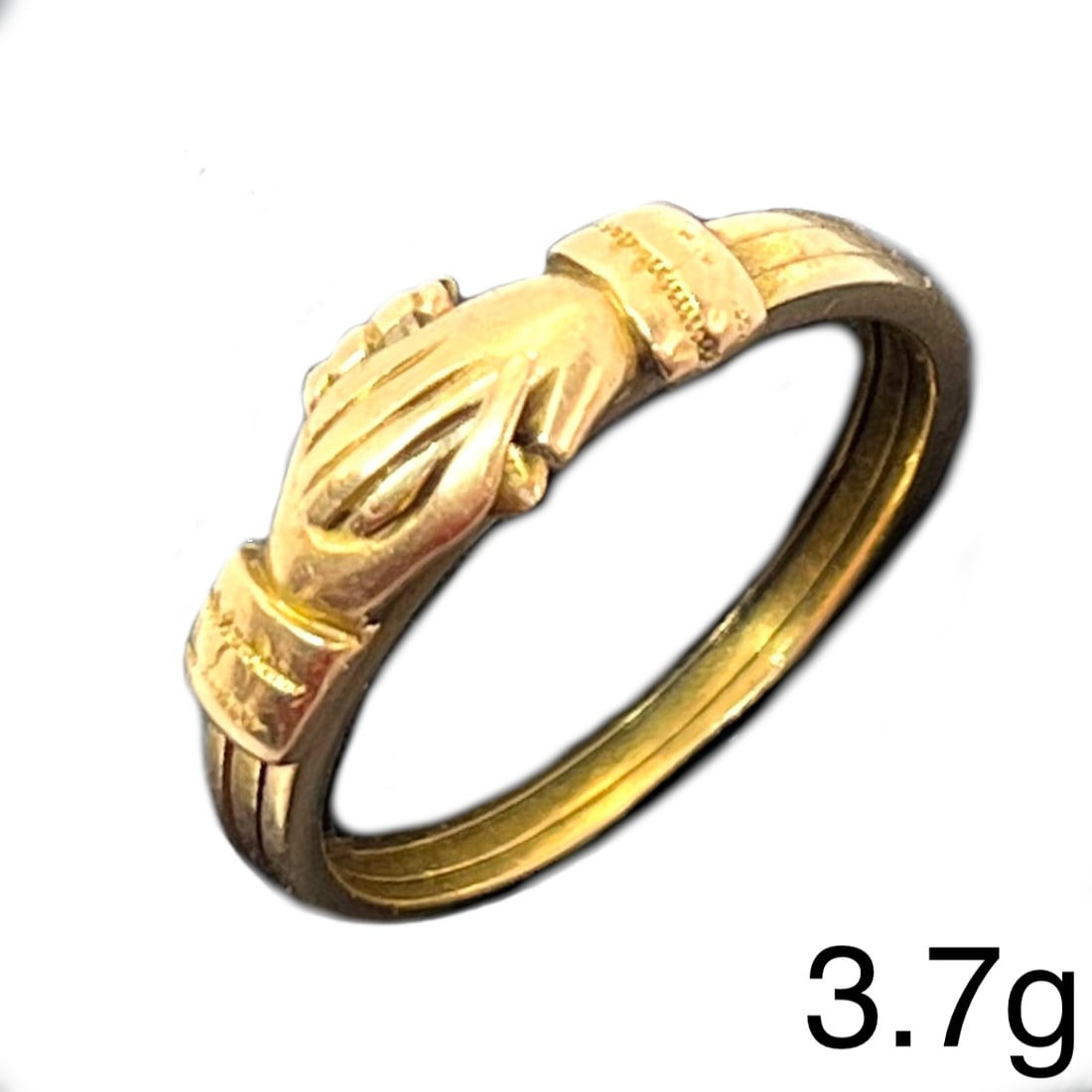 UNUSUAL ANTIQUE FEDE GIMMEL OPENING RING: UNUSUAL ANTIQUE FEDE GIMMEL OPENING RING,3,7 grams, testing high carat gold.Designed as 3 bands.The outer 2 bands with interlocking hands, can open to reveal the hidden heart.Size M.