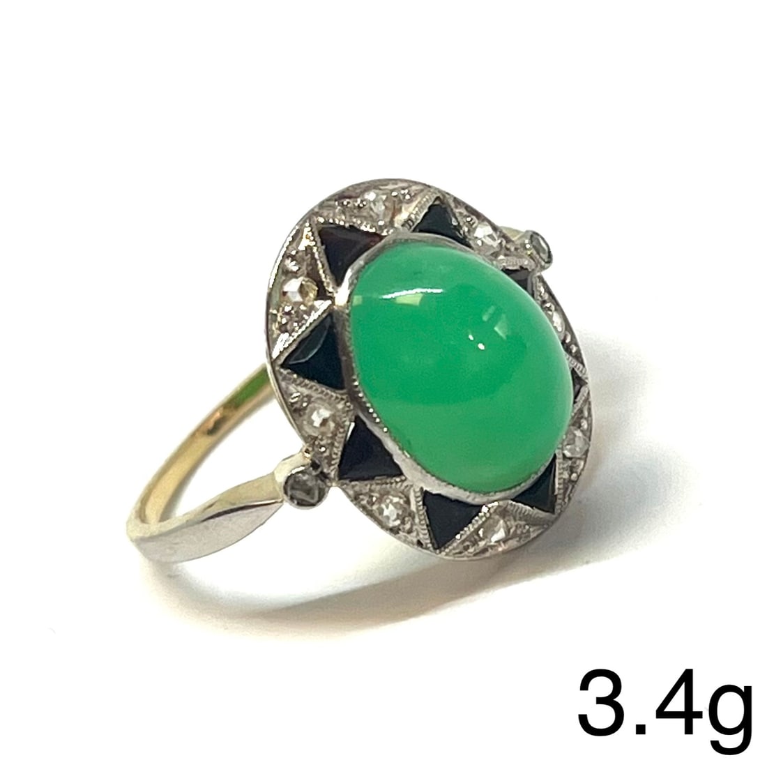 LOVELY ART-DECO CHRYSOPRASE, ONYX AND DIAMOND RING: LOVELY ART-DECO CHRYSOPRASE, ONYX AND DIAMOND RING,3,4 grams, testing platinum.Fine cabochon cut chrysoprase.Lovely calibre cut onyx.Diamonds bright and lively.Size L 1/2