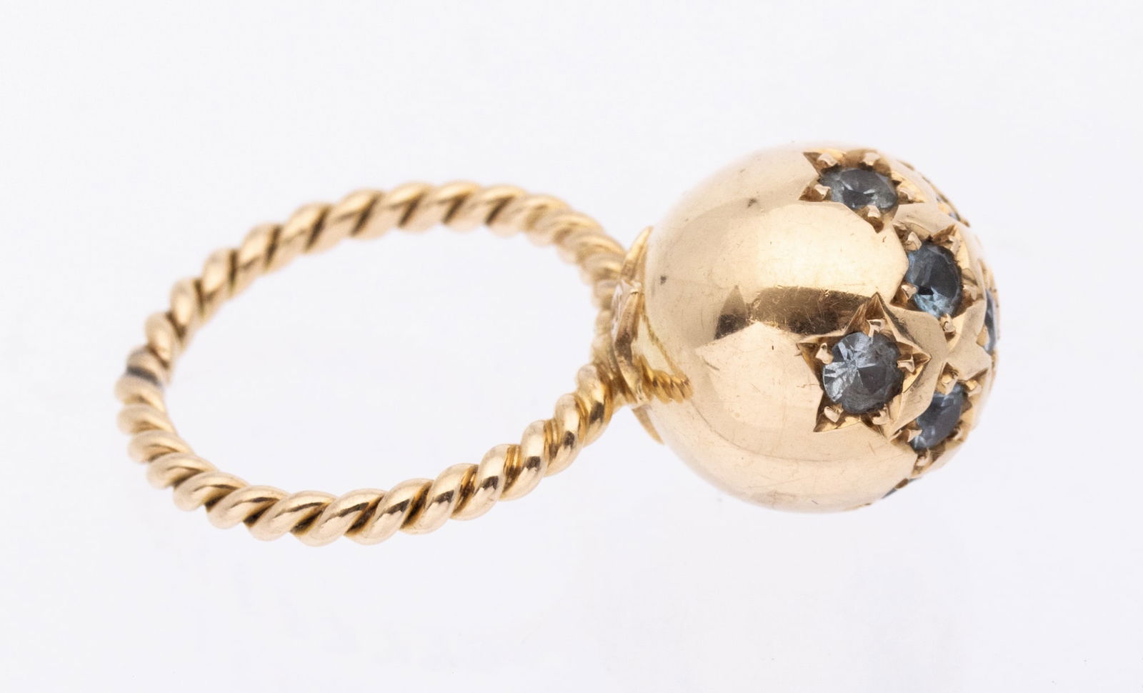RETRO TOPAZ SPHERE RING: RETRO TOPAZ SPHERE RING,6,1 grams, testing 18 ct. gold.The sphere set with lovely topaz.The shank of twisted design.Size H.