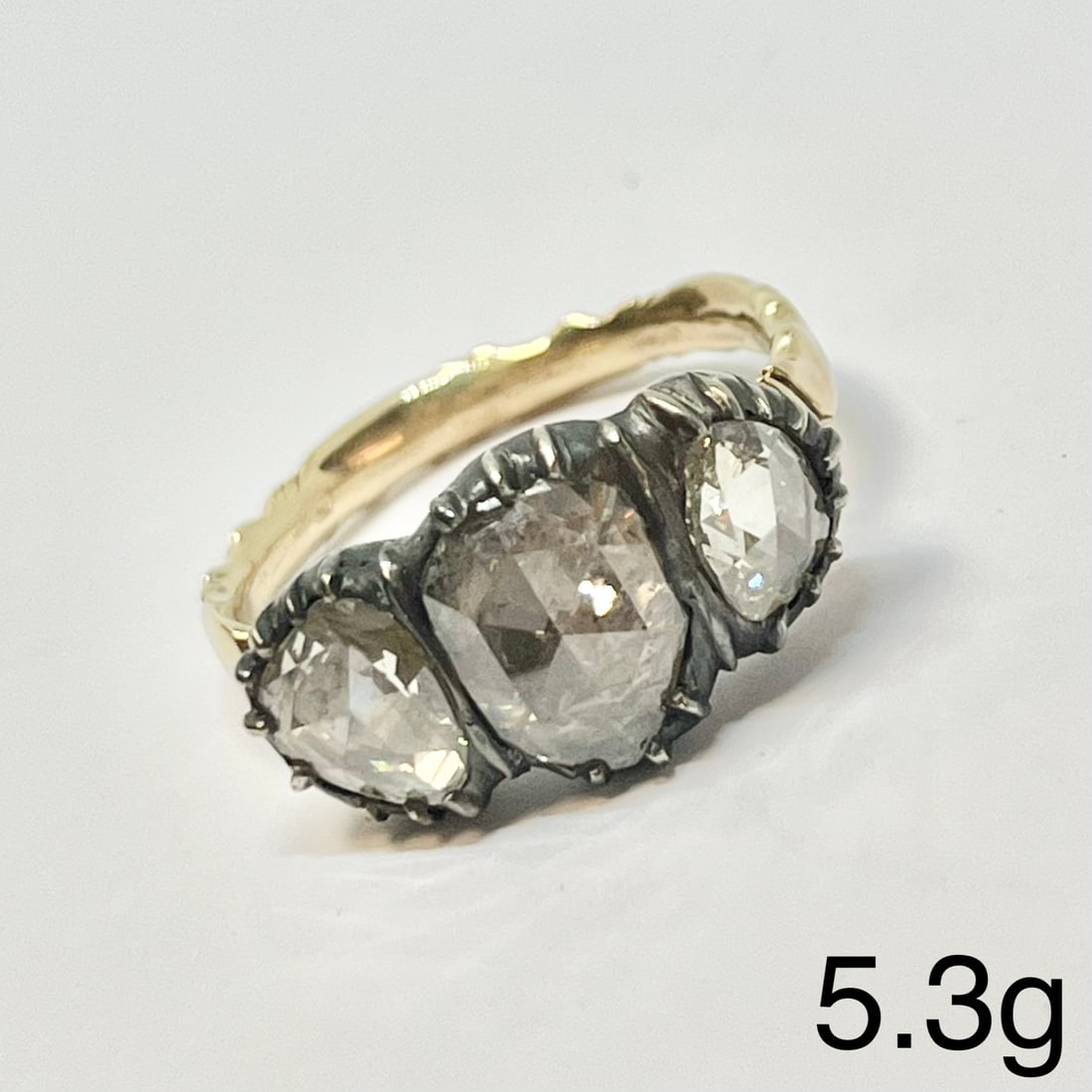 ANTIQUE ROSE CUT DIAMOND 3-STONE RING: ANTIQUE ROSE CUT DIAMOND 3-STONE RING,5,3 grams.Large rose cut diamonds, largest of approx. 9 x 6.8 mm.Lovely domed backs with relief lines.Size P 1/2.