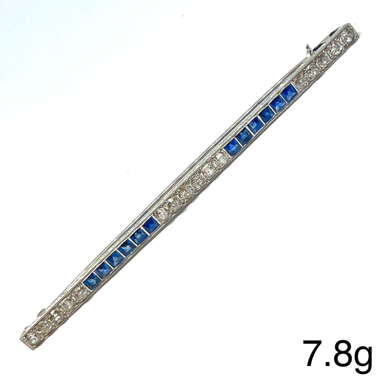 LARGE ART-DECO SAPPHIRE AND DIAMOND BROOCH: LARGE ART-DECO SAPPHIRE AND DIAMOND BROOCH,7.8 grams, testing 18 ct. gold.Bright and lively old cut diamonds, totalling approx. 2.25 ct.Rich and vibrant sapphires, totalling approx. 2.40 ct.W. 9.8 cm.