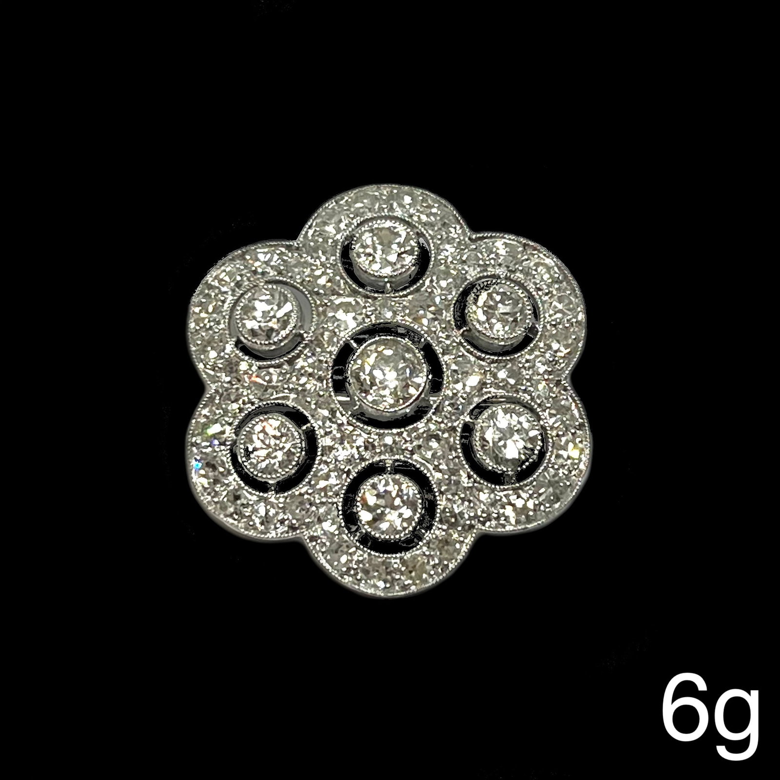 EDWARDIAN DIAMOND BROOCH: EDWARDIAN DIAMOND BROOCH,6 grams, testing platinum.Diamonds bright and lively, totalling approx. 3.20 ct.W. 2.6 cm.